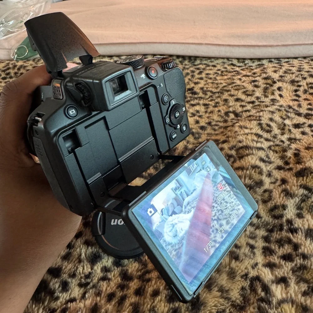 Nikon Black Camera with White Accessories